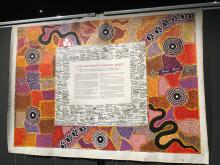 Photo of the signed and painted canvas of the Uluru Statement From the Heart